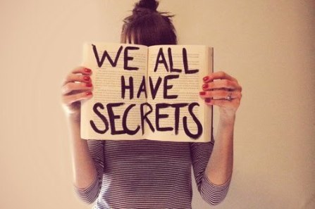 girl with book that reads we all have secrets